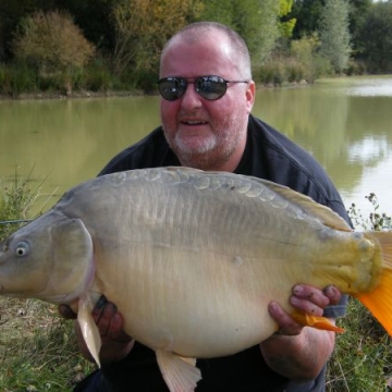 Carp (27lbs 2oz ) caught by Reg Miller at  France.