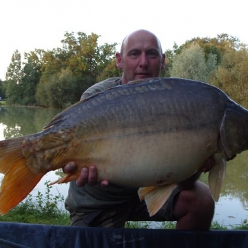 Carp (30lbs 4oz ) caught by Caught by Terri (held by Waine) at  France.