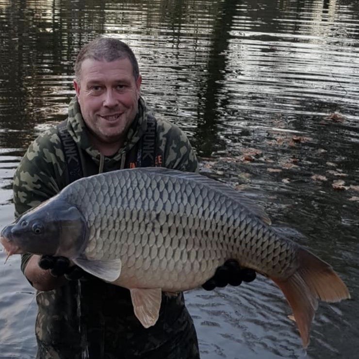 Owner John Lines with a carp stocked in December 2020